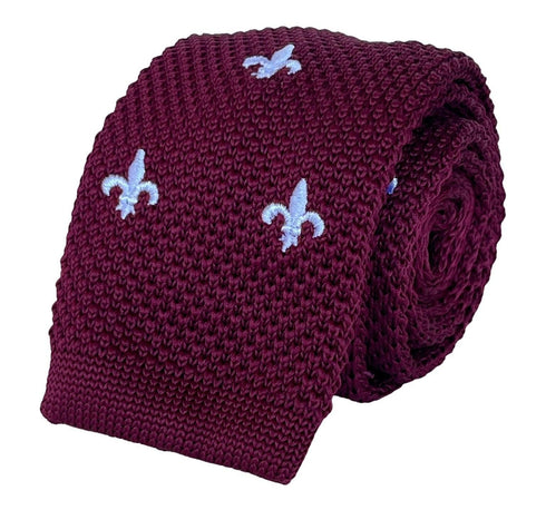 maroon knitted tie with white embroidered fleur de lis lys design